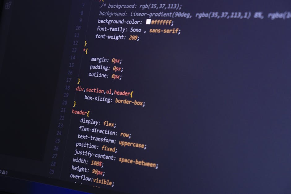 Close-up image of a computer screen displaying lines of HTML code with various tags such as <div>, <span>, and <a>. The code appears to be part of a website's layout or content management system, char